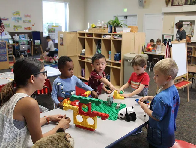 Rainbow Class kids being taught by teacher